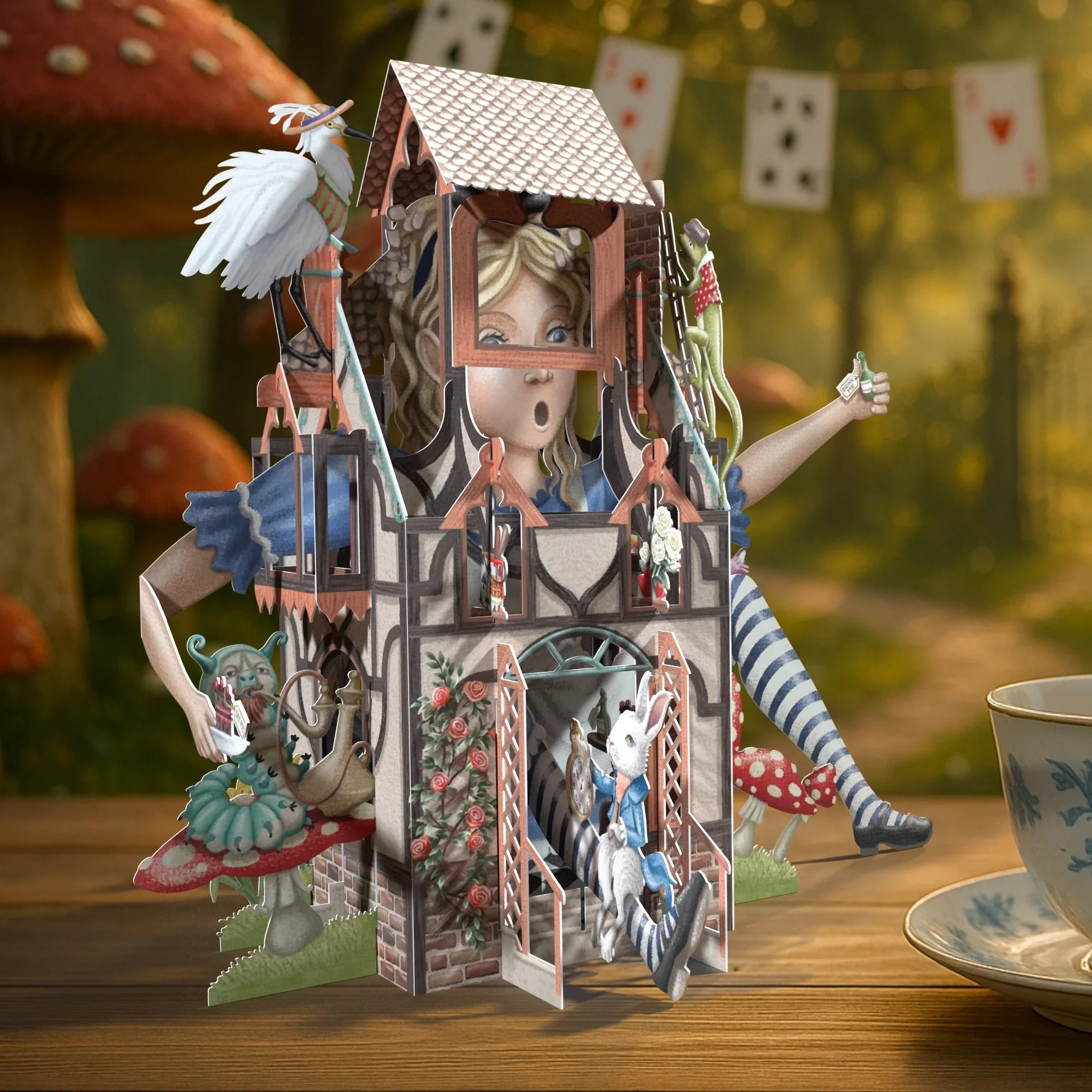 Pop-up book or toy with characters and scenic background on a wooden surface.